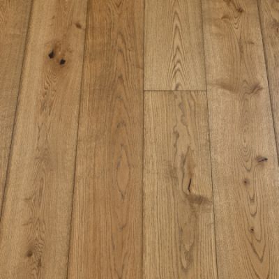 An image of coyote plank flooring. The planks exhibit a medium brown colour with rich wood grain textures, offering a rustic and earthy aesthetic.
