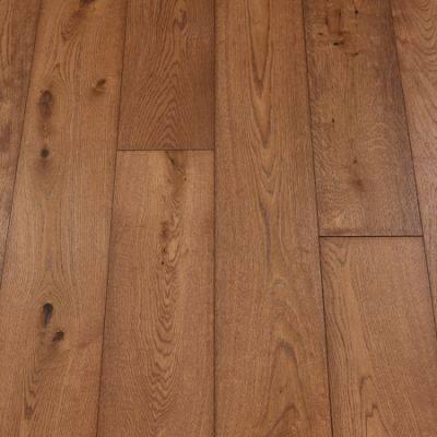 Mahogany Plank Flooring: A photograph of mahogany-themed plank flooring, featuring deep reddish-brown tones and a glossy finish, adding warmth and sophistication to interiors.
