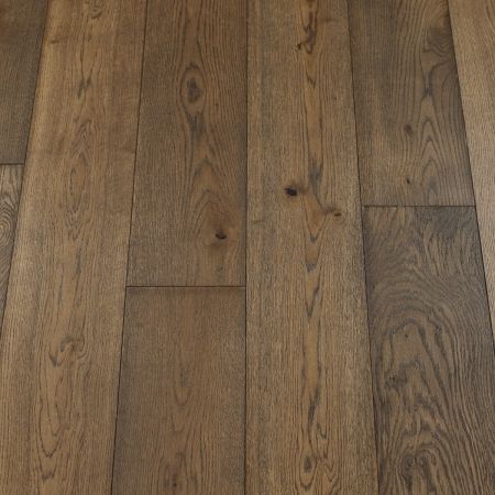 A detailed image of plank wood flooring with a rich mocha brown finish. The smooth texture and natural grain patterns highlight the warm, chocolatey tones, adding depth and character to the room.