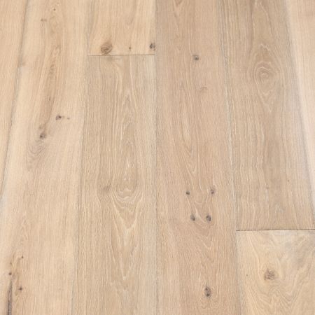 Platinum Plank: A close-up of Jordan's Woodflooring in Platinum, highlighting bright, silvery tones with a polished, high-gloss finish.