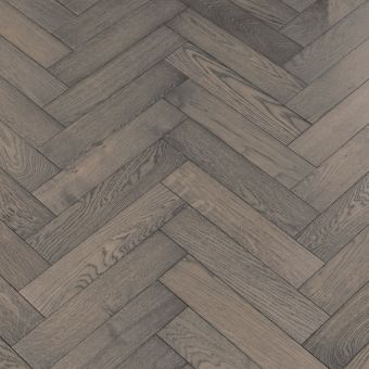 Small Herringbone Boulder: Detailed view of Jordan's Woodflooring small herringbone pattern in Boulder, featuring cool, grey tones with a textured, contemporary finish.