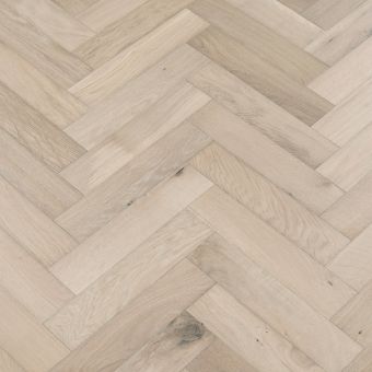Resized Small Herringbone Glacier Flooring: A close-up of Jordan's Woodflooring herringbone pattern flooring in glacier colour, showcasing its cool and crisp appearance.
