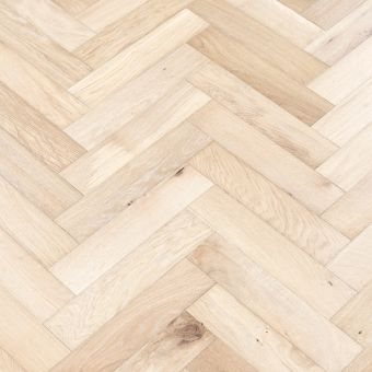 Ivory Herringbone Flooring: A close-up view of ivory-coloured herringbone patterned flooring, featuring a classic and elegant design suitable for various interior styles.