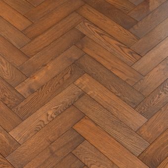 Resized Small Herringbone Mahogany Flooring: A detailed view of Jordan's Woodflooring herringbone pattern flooring in mahogany, showcasing its deep brown tones and natural wood texture.