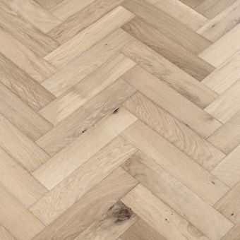 Moonstone Herringbone Flooring: A detailed image of moonstone-coloured herringbone patterned flooring, showcasing subtle gray tones with a polished finish, ideal for contemporary spaces.
