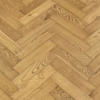 Smoked Herringbone Flooring: A close-up view of smoked-coloured herringbone patterned flooring, displaying a mix of gray and brown shades with a rustic, weathered appearance, perfect for a farmhouse or vintage style.