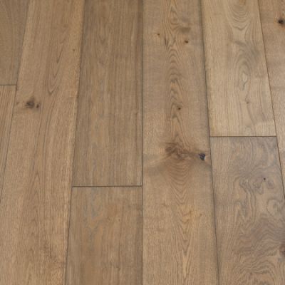 Slate Plank Flooring: A photograph displaying slate-inspired plank flooring, featuring dark gray tones and a textured surface, perfect for modern and industrial-themed interiors.