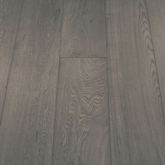 A wide plank flooring in a boulder finish, featuring neutral grey tones with a slightly textured surface. The wide boards and natural grain patterns give a bold yet understated look, ideal for modern interiors.