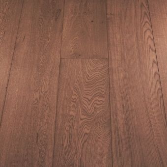 A wide plank wooden floor in a carmine red shade. The wide planks have a semi-gloss finish, with natural wood grains and textures visible, adding a bold and striking look to the flooring. This vibrant colour is perfect for making a statement in any room.
