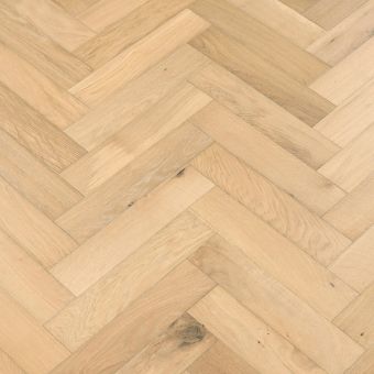 Shandy Herringbone Flooring: An image displaying shandy-coloured herringbone patterned flooring, featuring warm golden hues reminiscent of the popular beverage, adding brightness and cheerfulness to rooms.